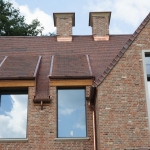 new-house-with-antique-european-roof-and-bricks